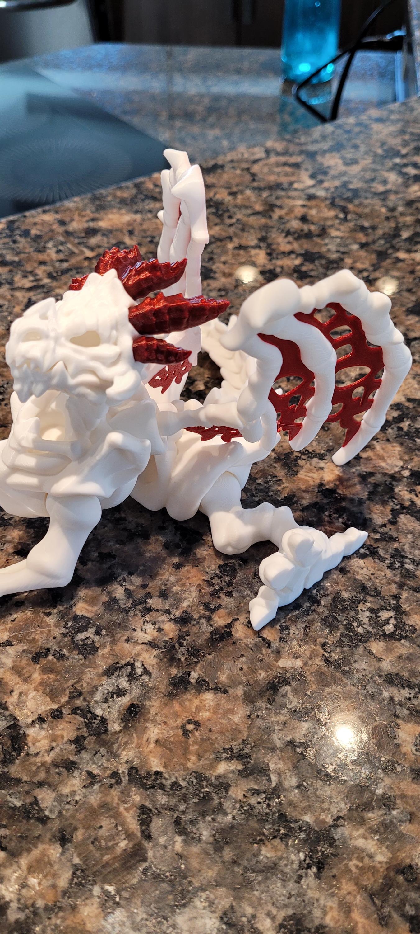 3D Printed Articulated Skeleton Dragon – Customizable Colors, White Body with Blue or Red Web Wings & Horns – Unique Fantasy Decor