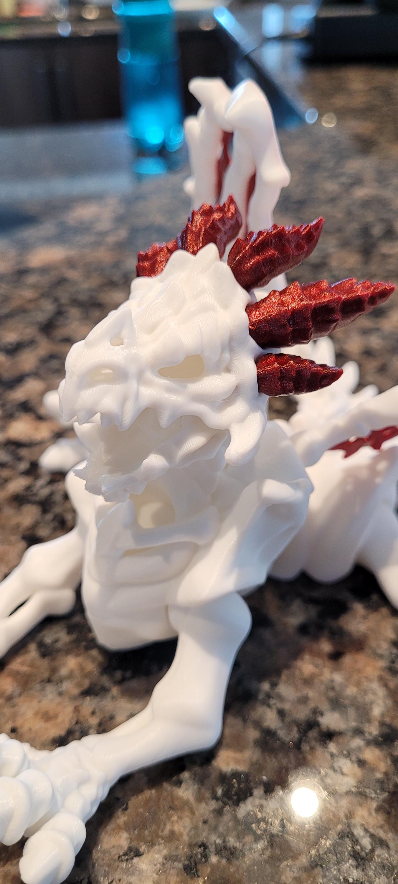 3D Printed Articulated Skeleton Dragon – Customizable Colors, White Body with Blue or Red Web Wings & Horns – Unique Fantasy Decor